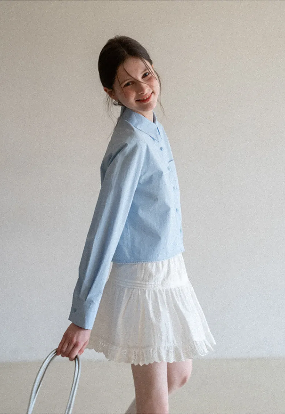 Long sleeve button front shirt with scalloped hem