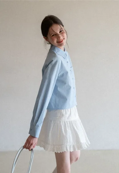 Long sleeve button front shirt with scalloped hem