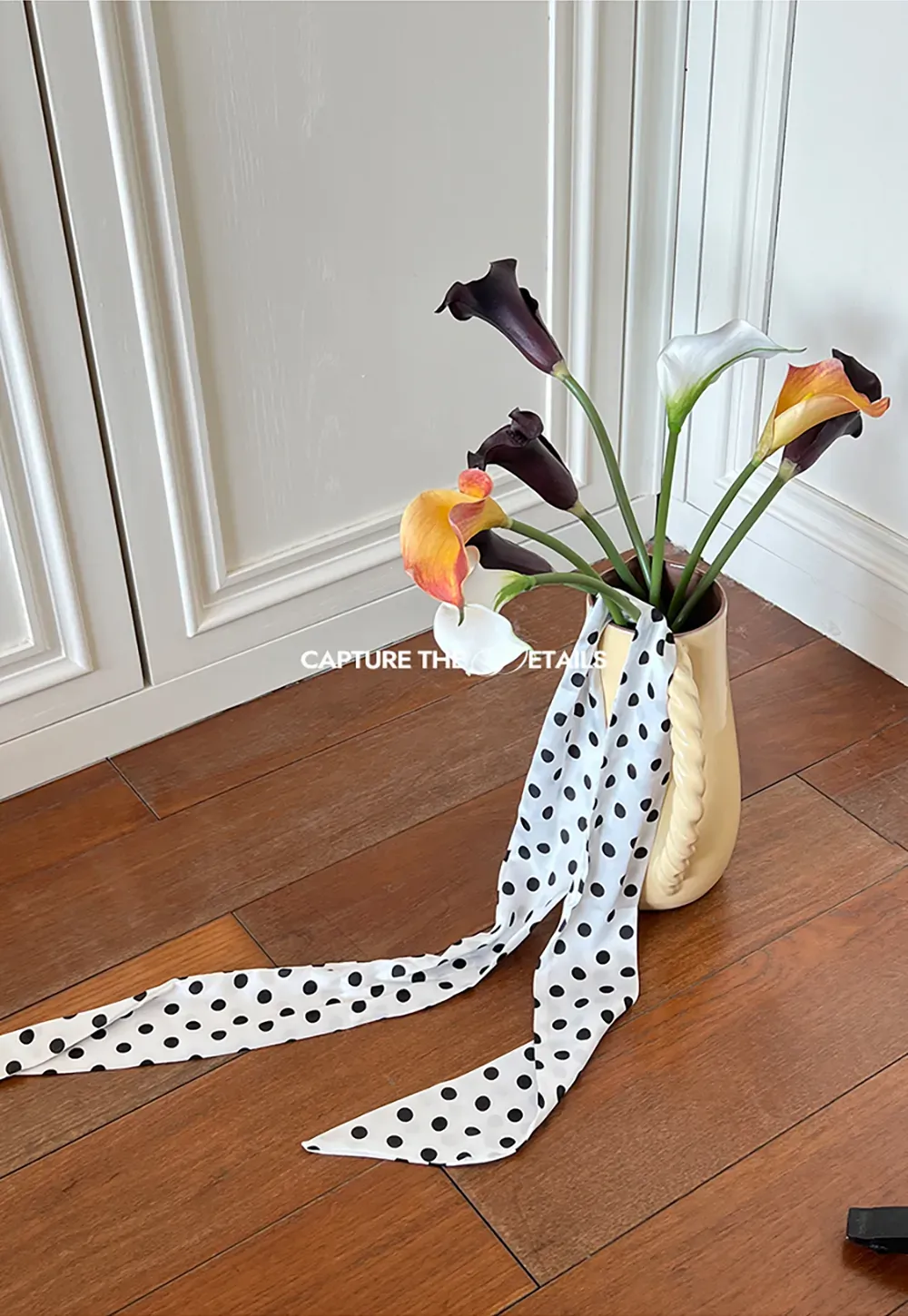 Elegant polka dot neck tie with bow design for women's fashion.