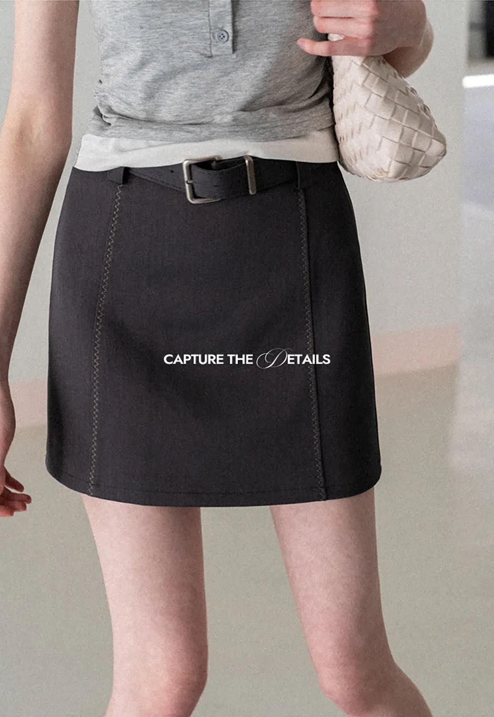 A-line mini skirt with contrast stitching and belt