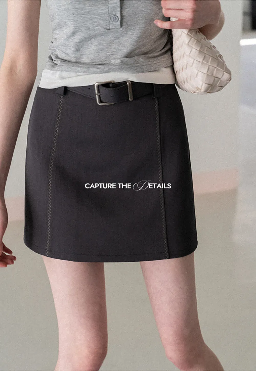 A-line mini skirt with contrast stitching and belt