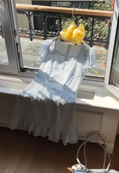 Eyelet dress with puff sleeves and ruffled hem