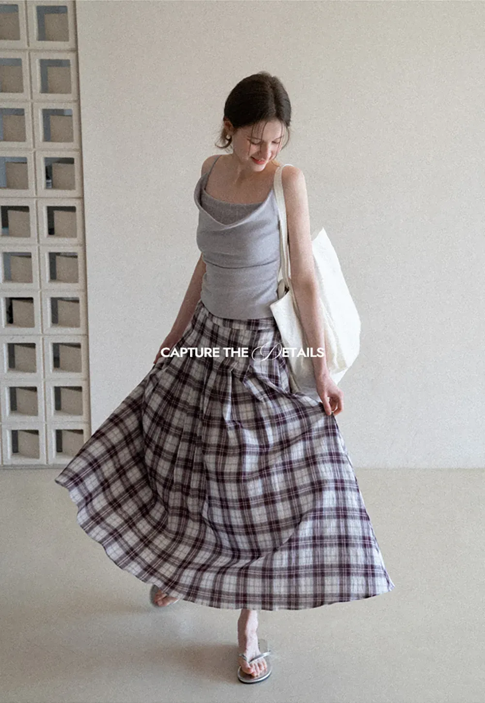 Silk-like tank top with thin straps and draped neckline