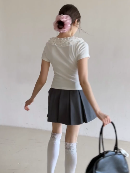 Short sleeve knit top with ruffled neckline