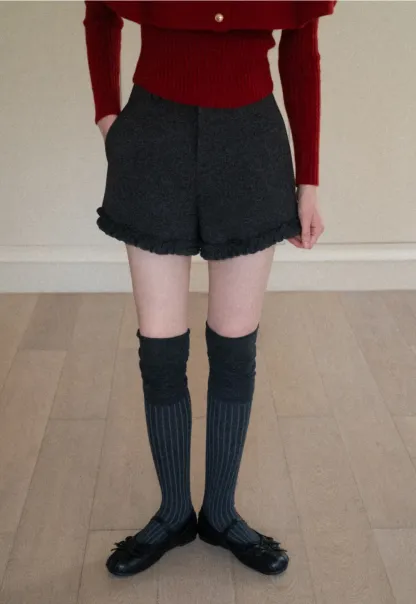 High waist shorts with ruffle hem and belt design