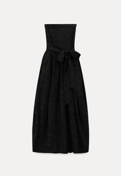Elegant strapless midi dress with flowing skirt and textured fabric