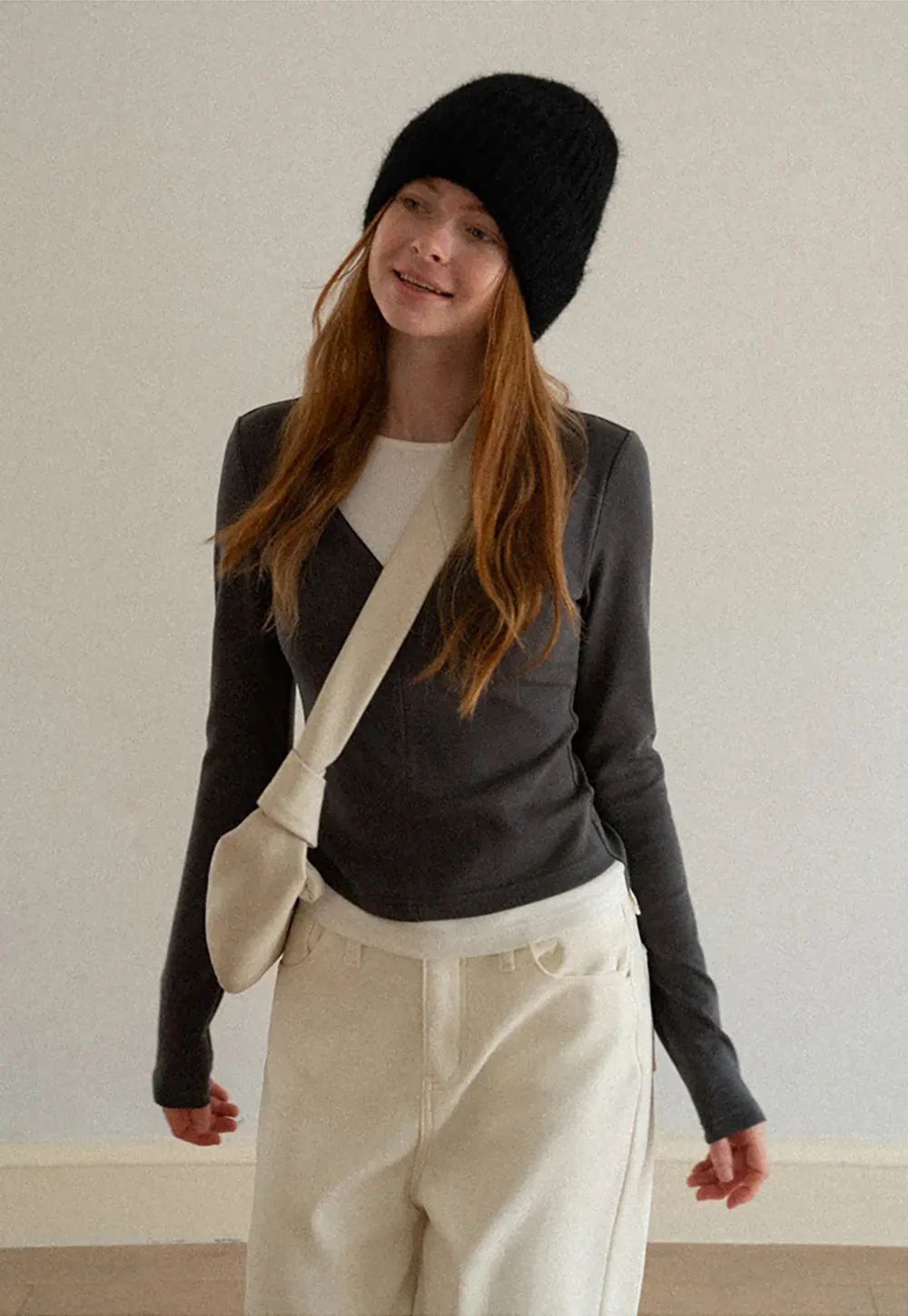 Long sleeve crop top with round neck and hem stitching design