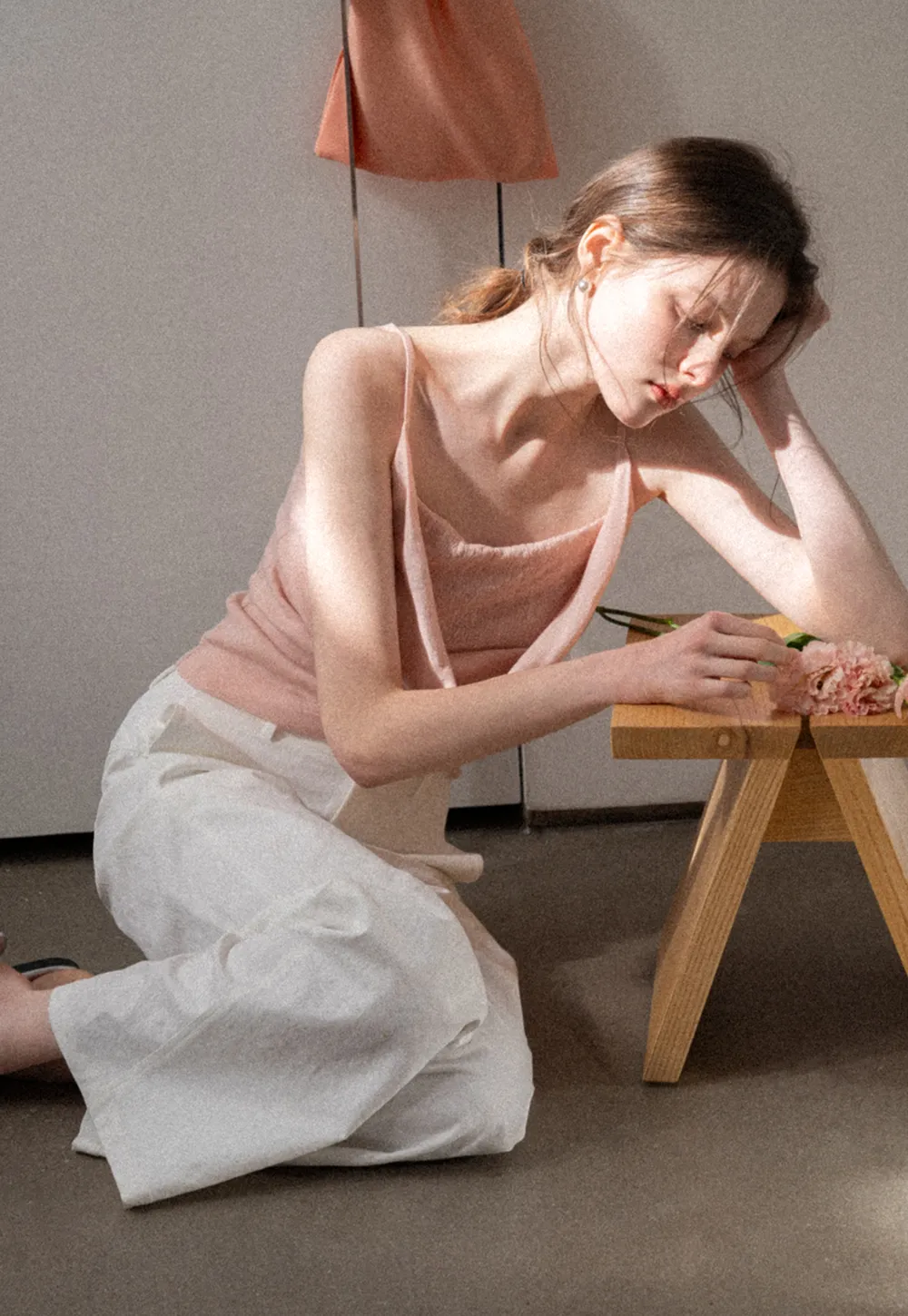 Silk-like tank top with thin straps and draped neckline