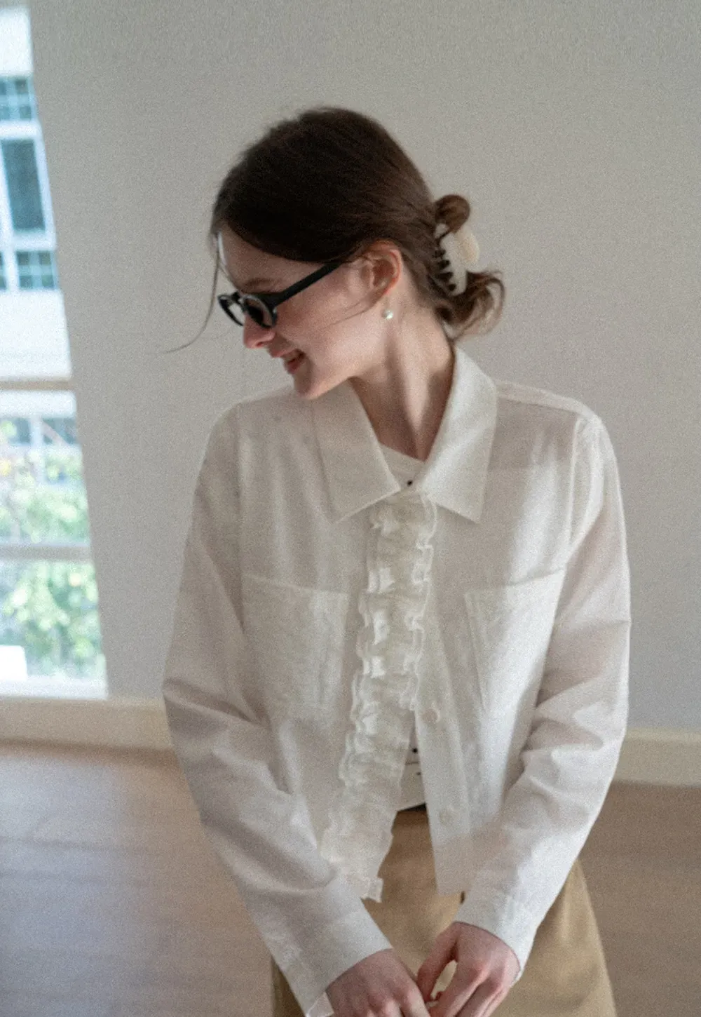 Short jacket with ruffled front placket and collar