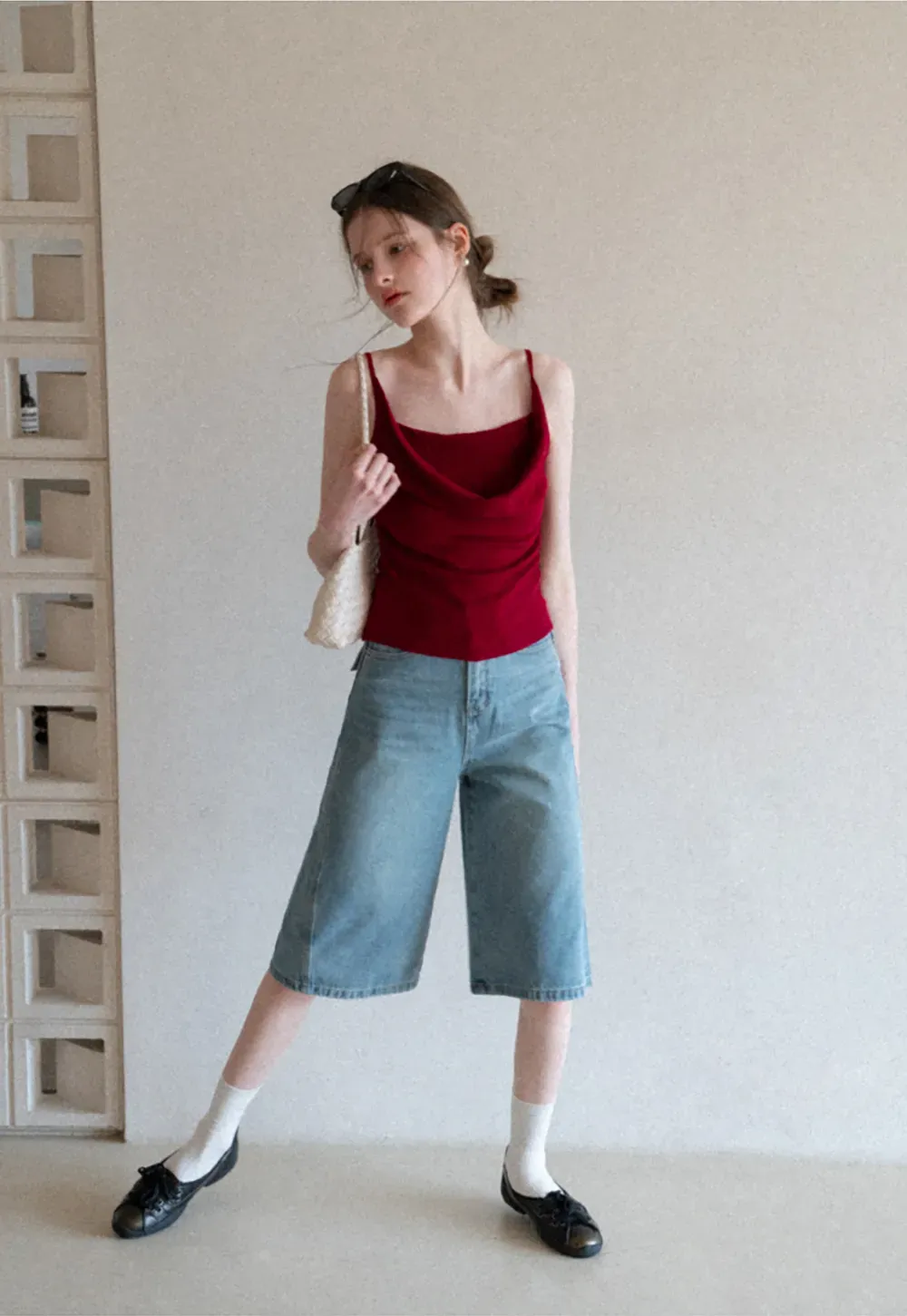 Silk-like tank top with thin straps and draped neckline