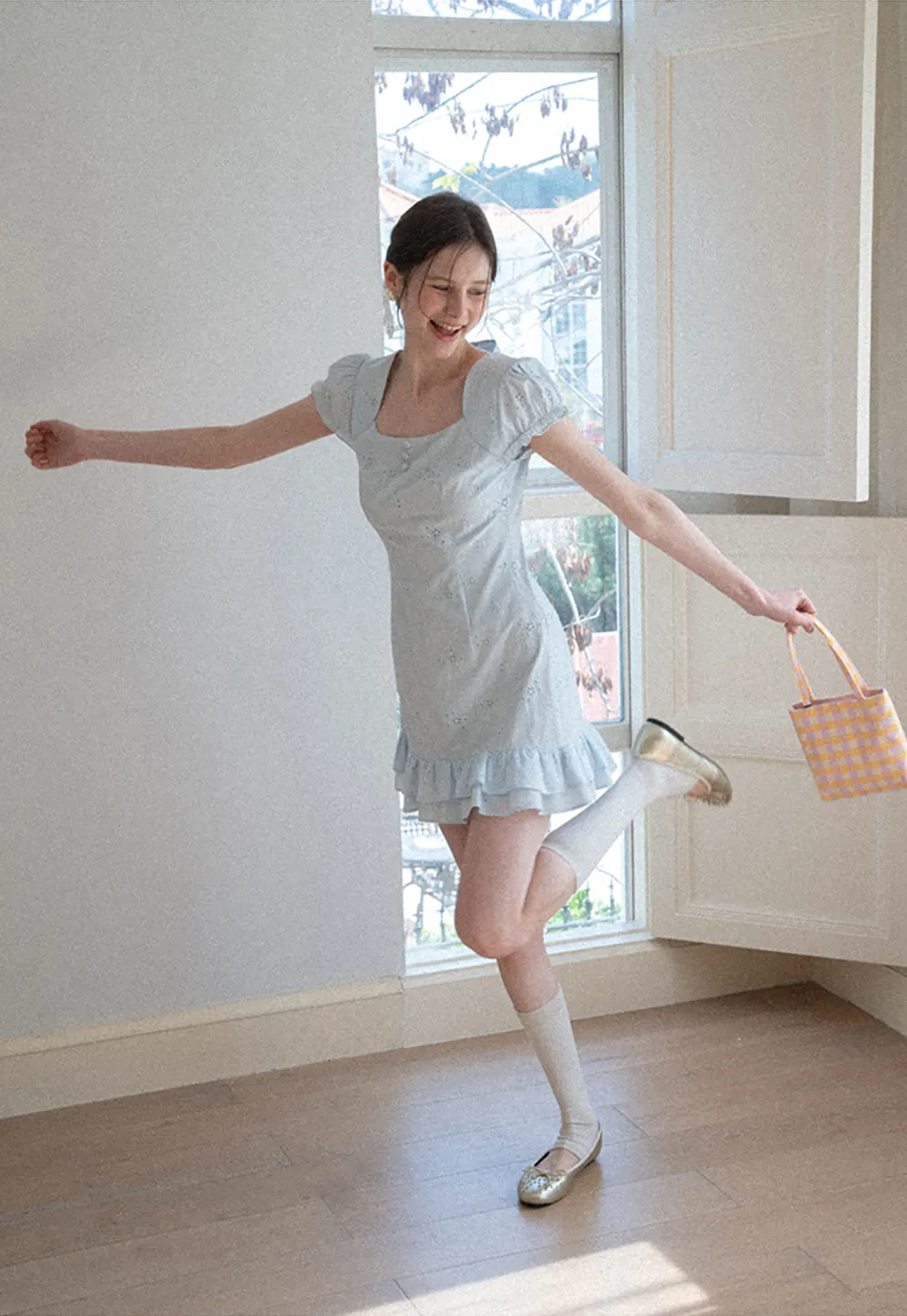 Eyelet dress with puff sleeves and ruffled hem