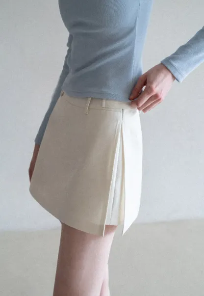 Elegant Pleated Mini Skirt with Asymmetrical Hem