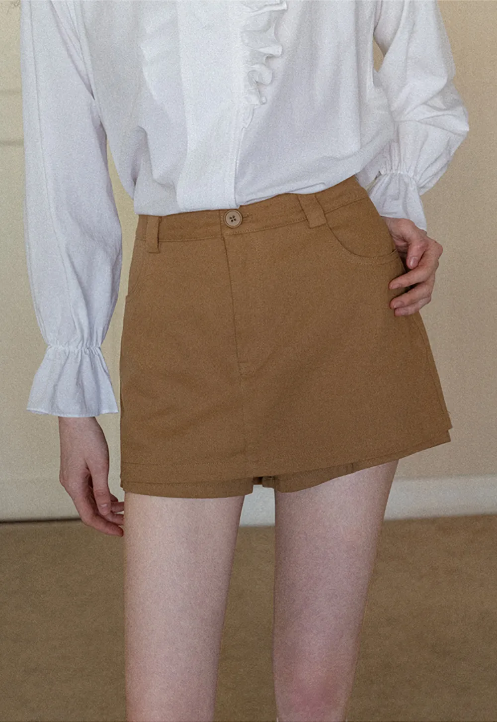 High waist pleated mini skirt with button front design