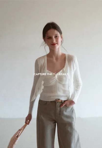 Ribbed knit sweater with V neckline and long sleeves