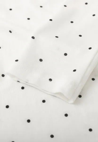 Polka dot long sleeve top with ruffled neckline