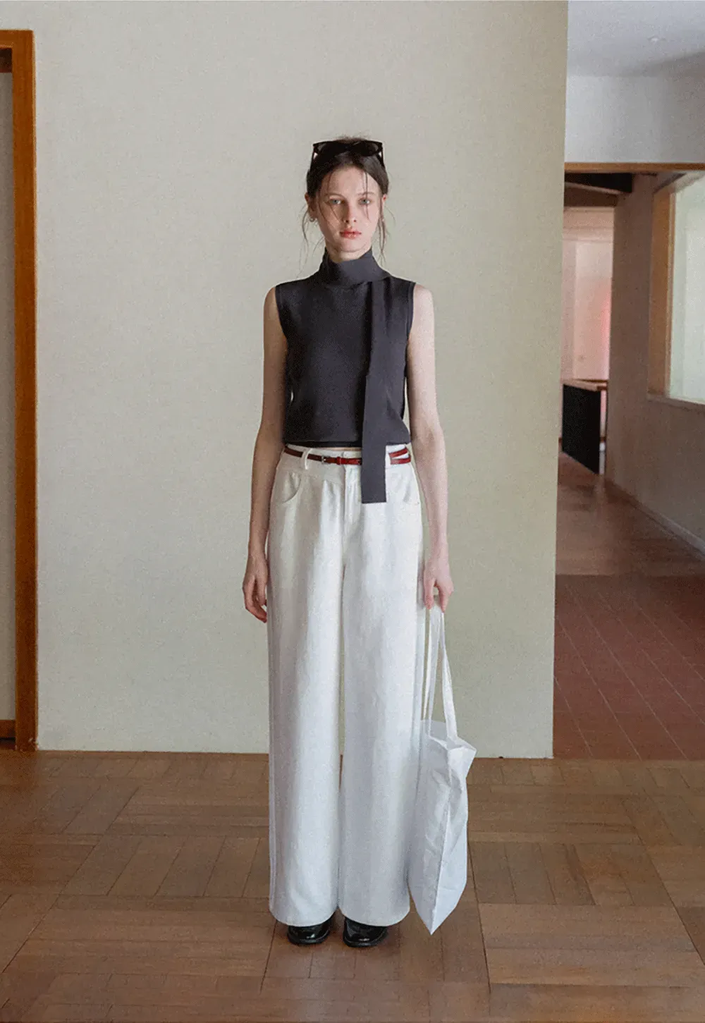 Sleeveless high neck knit top with side tie detail