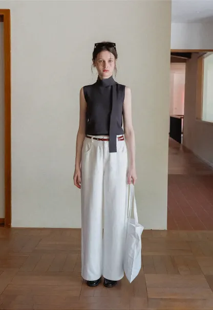 Sleeveless high neck knit top with side tie detail