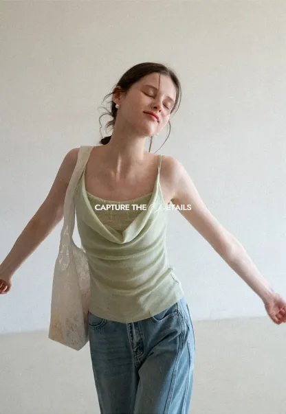 Silk-like tank top with thin straps and draped neckline