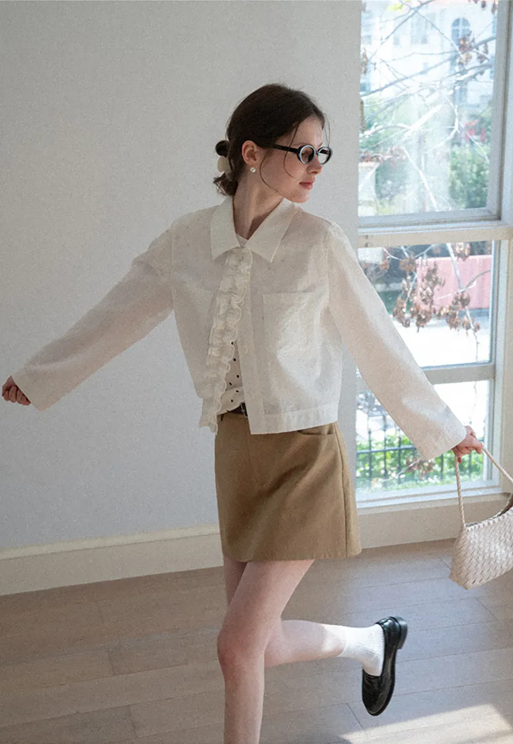 Short jacket with ruffled front placket and collar