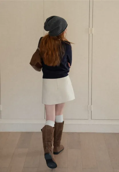 A-line mini skirt with textured fabric and central seam design