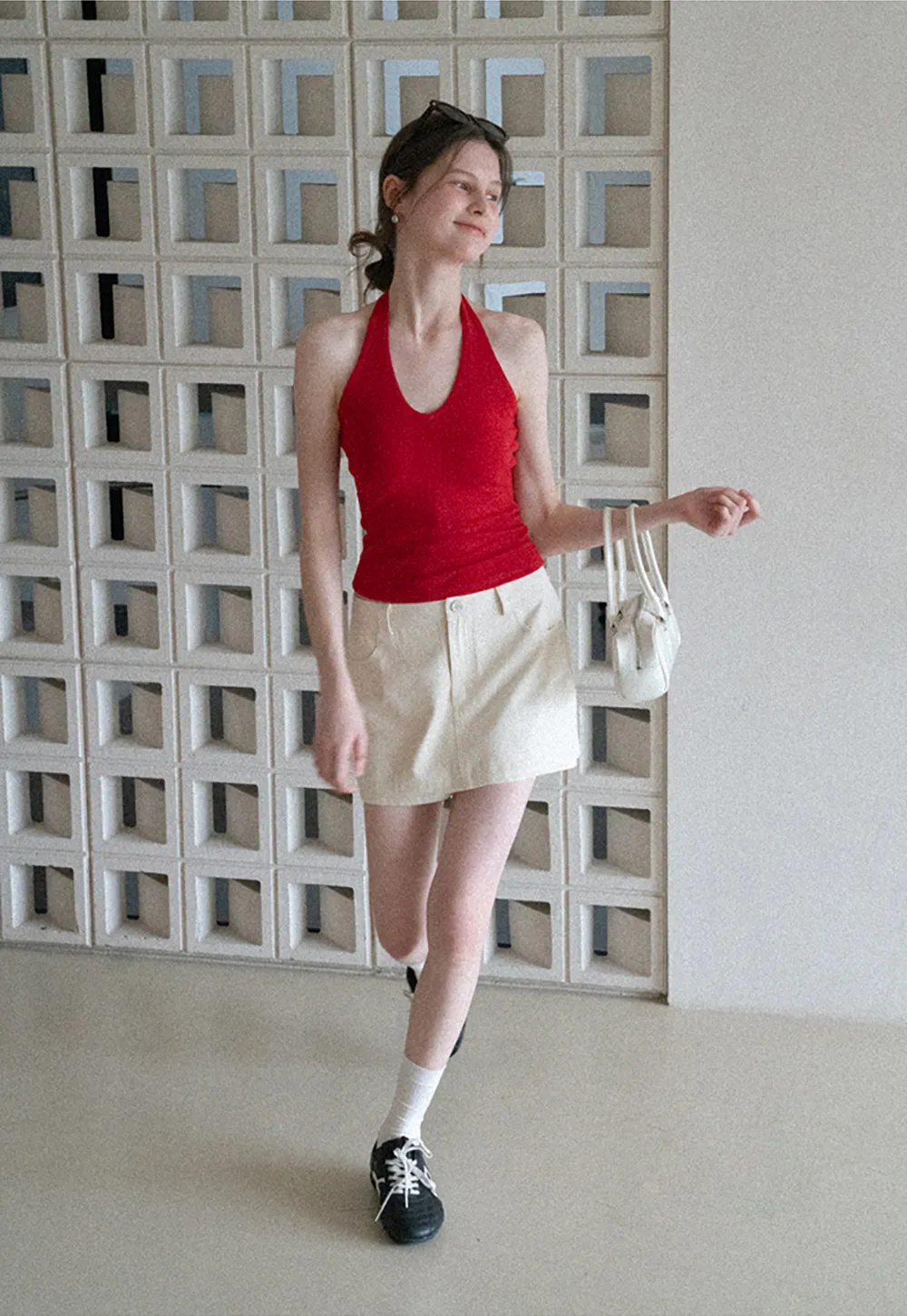 High waist pleated mini skirt with button front design