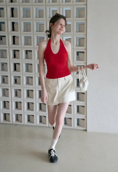 High waist pleated mini skirt with button front design