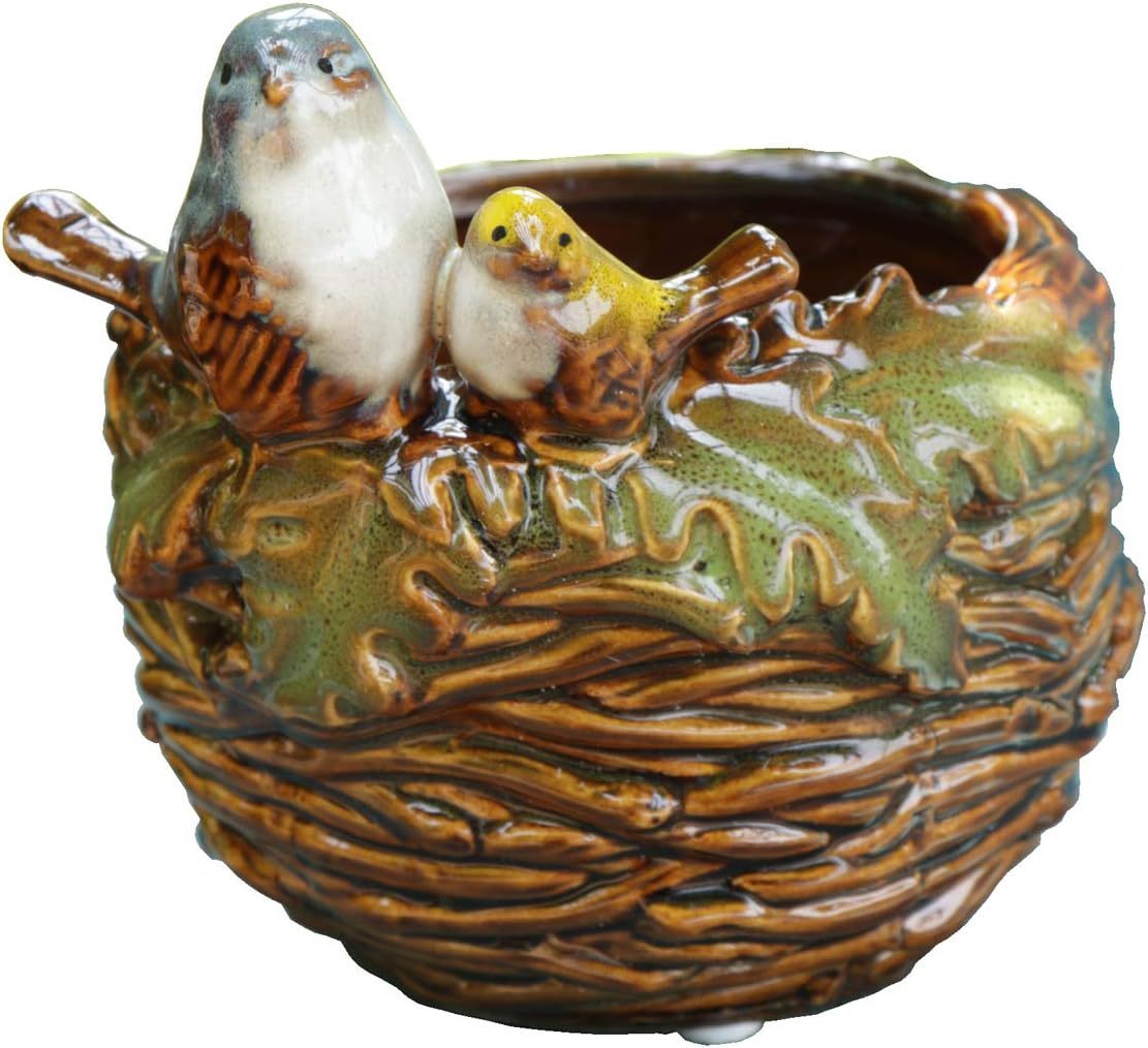 Handcrafted Bird Nest Planter – A Charming Touch of Nature  Artisan-Crafted Design • Meticulously hand-shaped ceramic with realistic nest texture • Adorable mother bird figurine perched lovingly on the rim • Earthy neutral tones blend seamlessly with any 