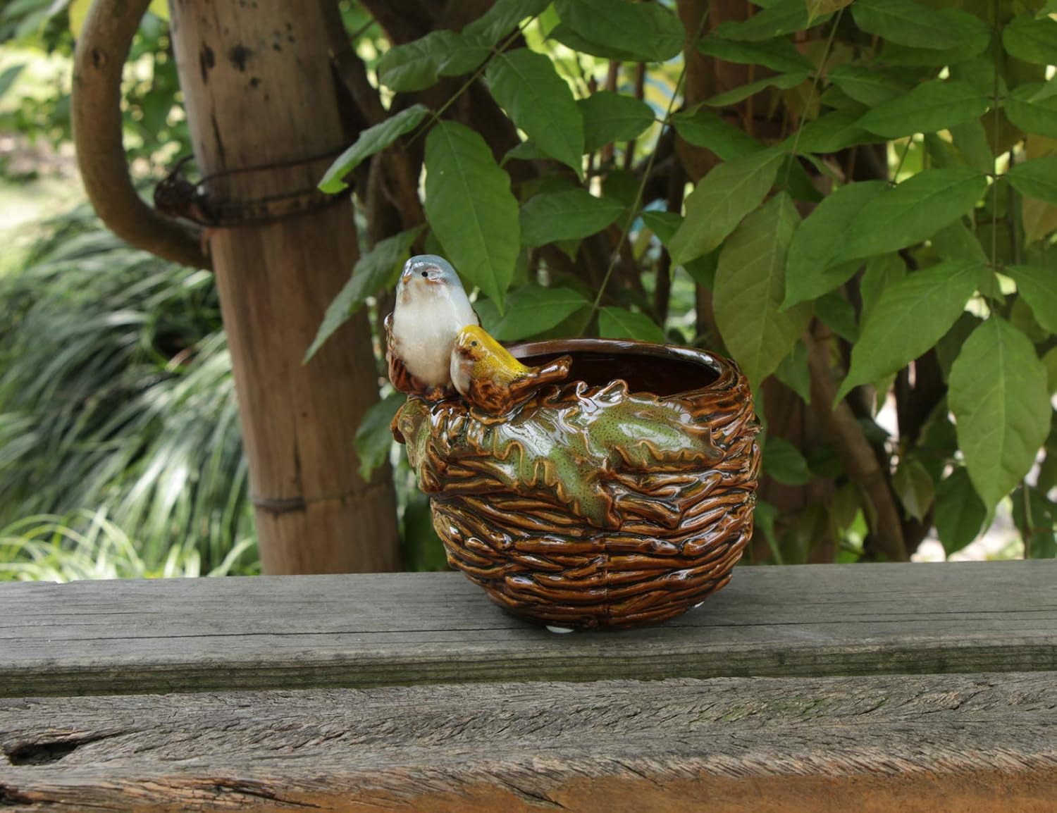 Handcrafted Bird Nest Planter – A Charming Touch of Nature  Artisan-Crafted Design • Meticulously hand-shaped ceramic with realistic nest texture • Adorable mother bird figurine perched lovingly on the rim • Earthy neutral tones blend seamlessly with any 