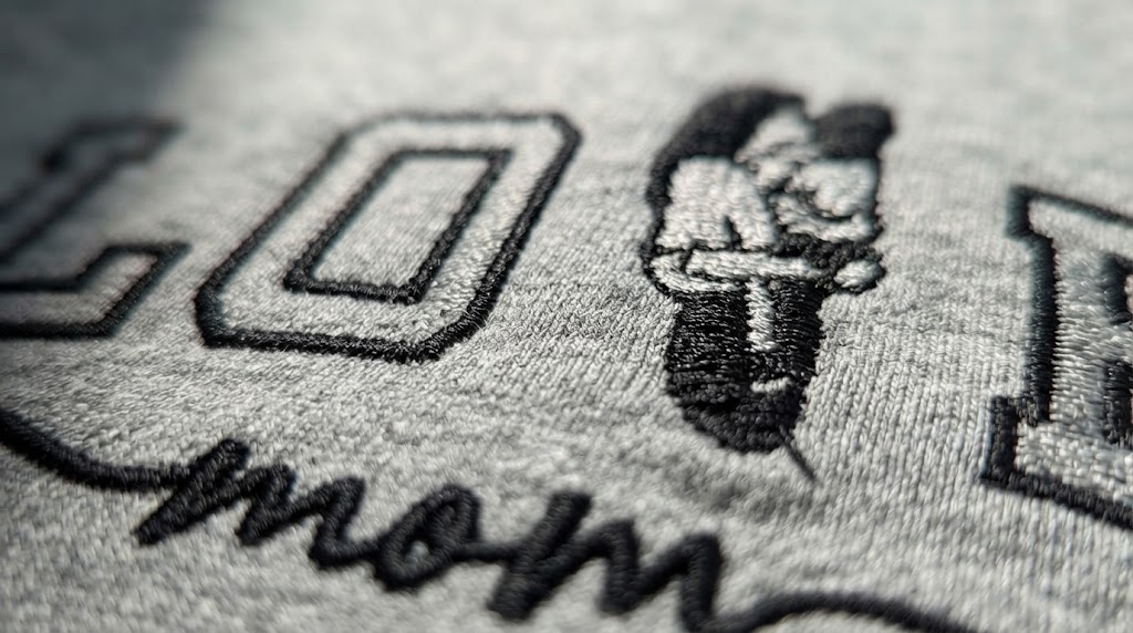 Close-up of embroidered thread texture on a personalized sweatshirt