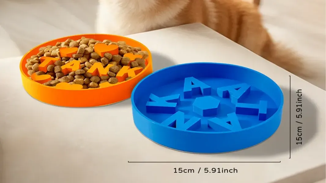 Personalized 3D printed slow feeder dog bowl with engraved pet name on a kitchen floor, dog paws partially visible reaching toward it