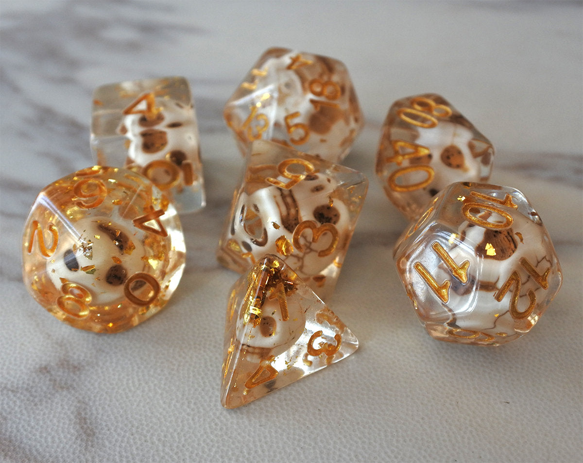 Skulls Laying in Golden Treasure Dice Set