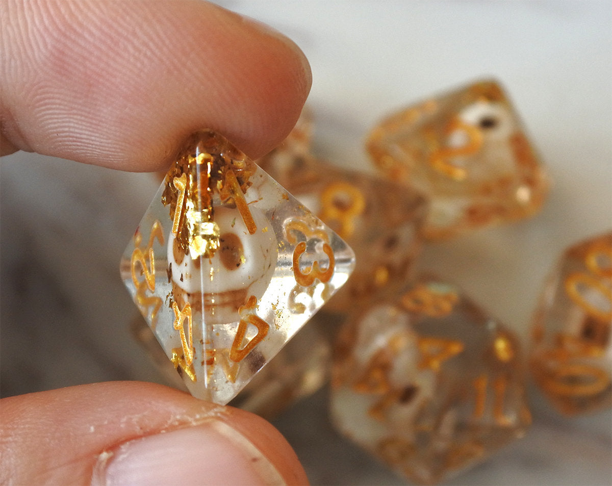 Skulls Laying in Golden Treasure Dice Set