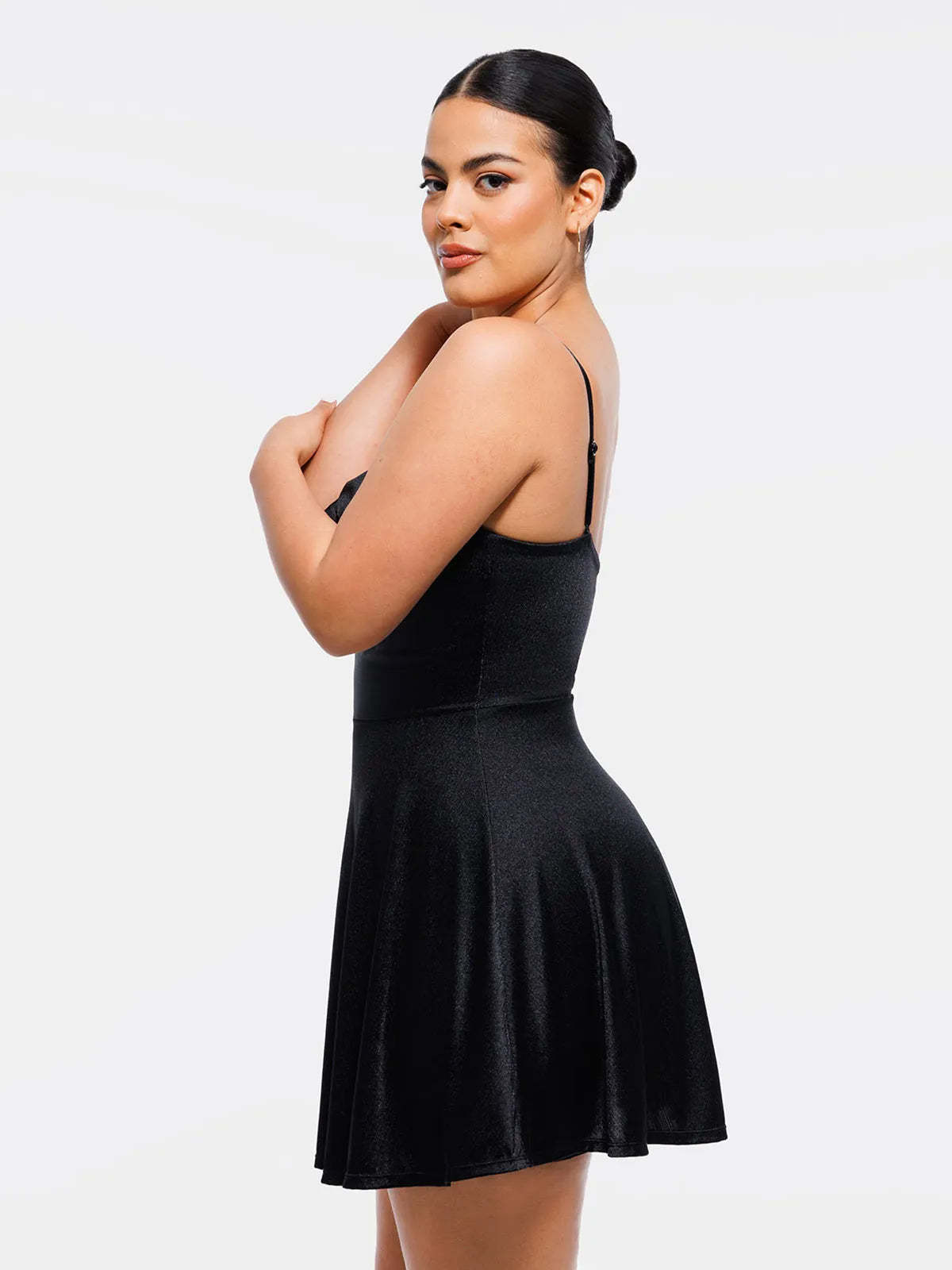 Elegant shapewear from Popilush®, woman wearing a black strappy dress with a flattering flare skirt