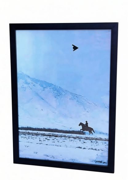 Artwork wall hanging featuring "B2 stealth bomber and cowboy on horseback".
