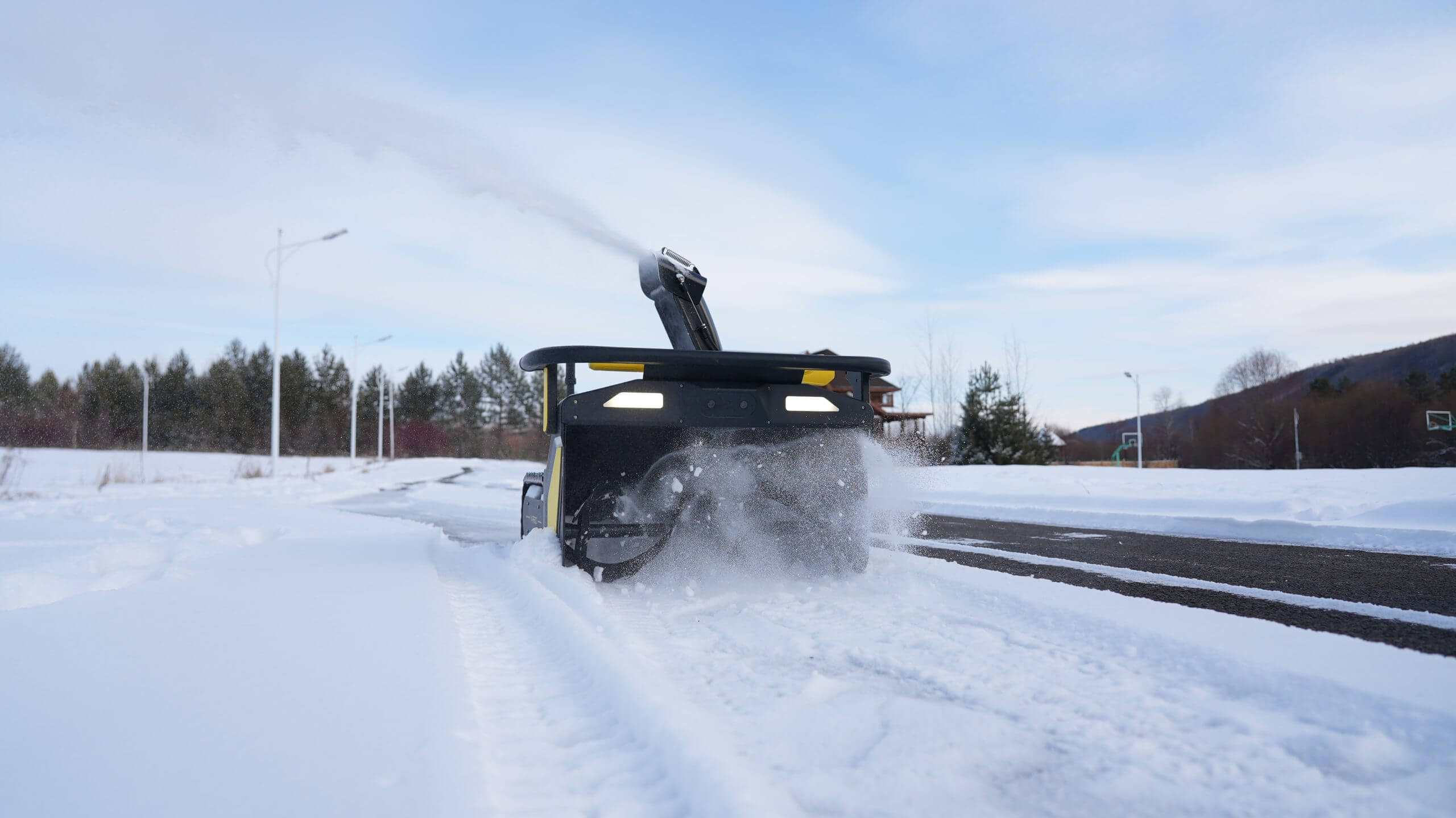 Yarbo Snow Blower clearing a driveway effortlessly, showcasing smart and efficient snow removal solutions.
