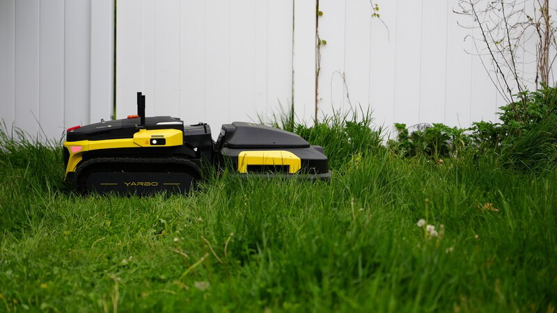 Robot Lawn Mowers cutting tall grass 