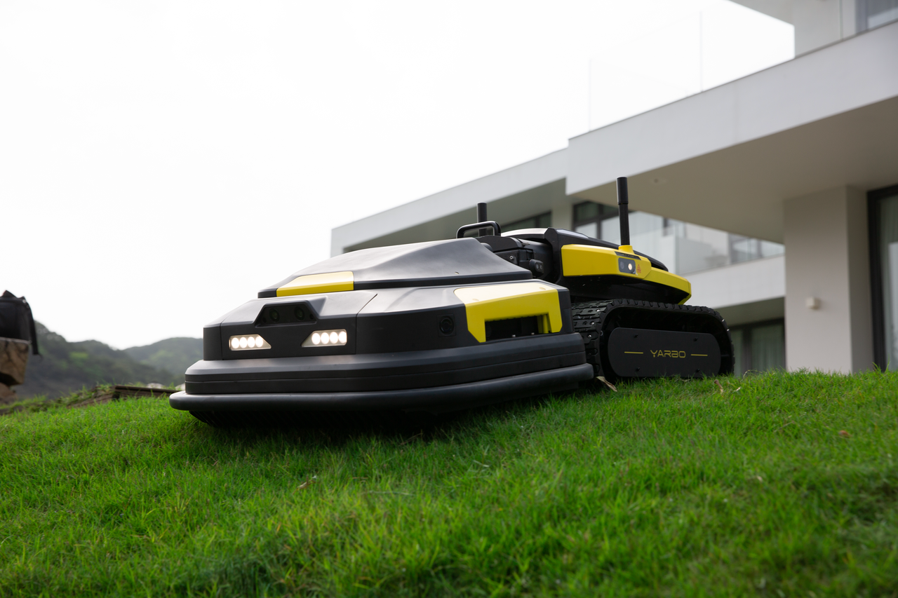 Yarbo robotic mower on a sloped lawn