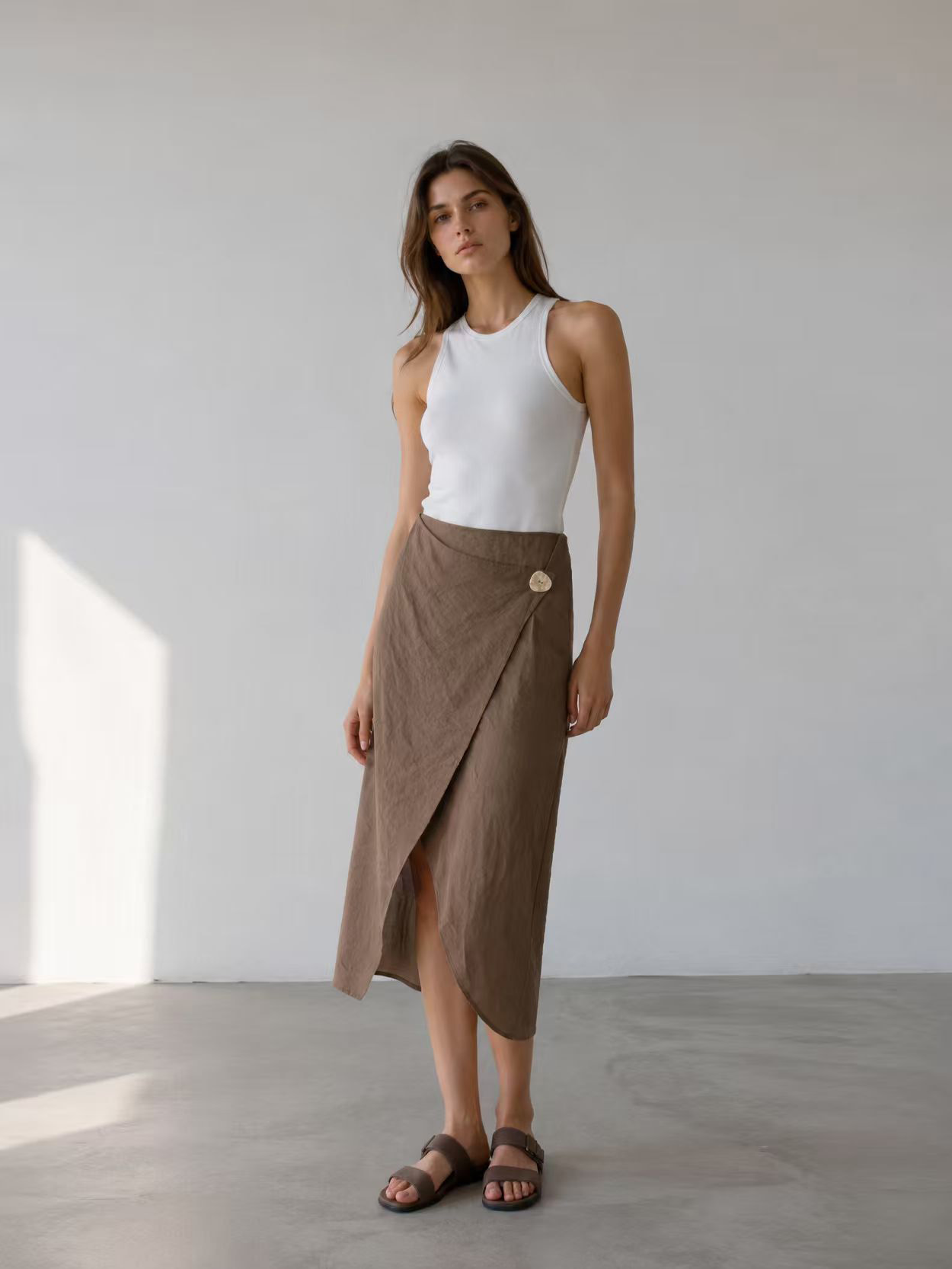 English: Minimalist Linen-Blend Wrap Midi Skirt with Asymmetrical Button AN-620037