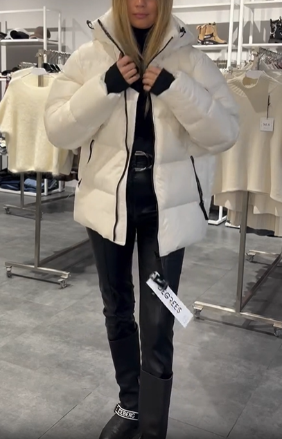 Thick hooded down jacket with built-in shoulder straps