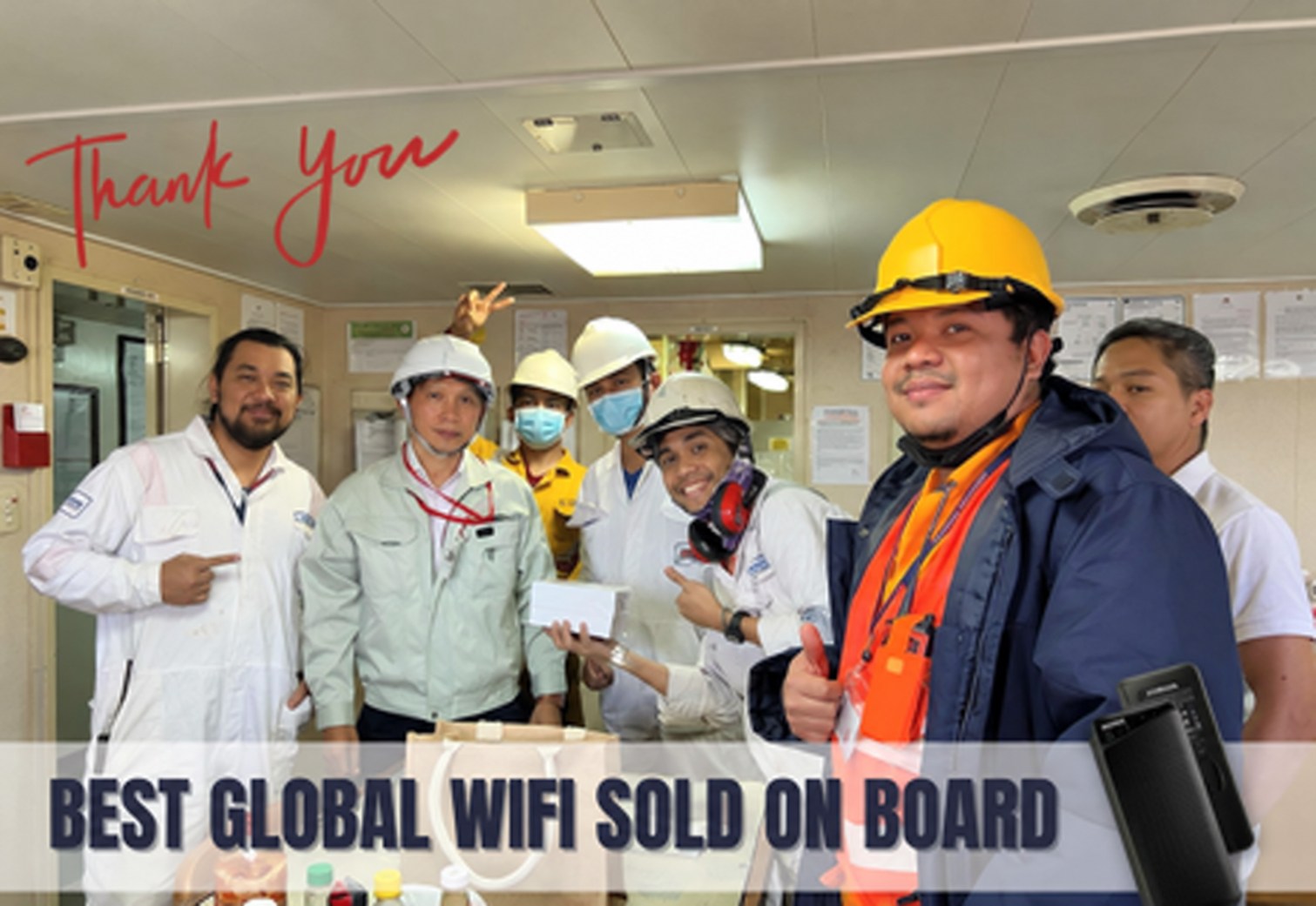 Group of seafarer customers aboard a vessel in a shipboard photo supplied by NomadsFi.