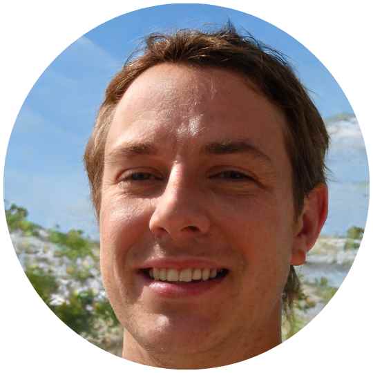 Smiling man with outdoor background, portrait in circular frame.