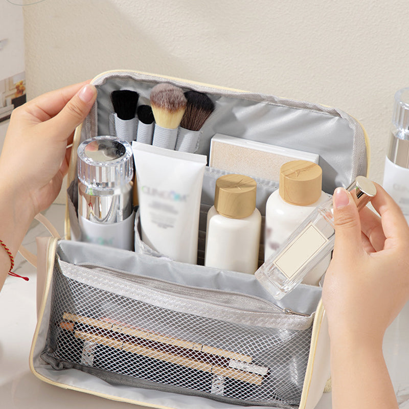 Partitioned cosmetic bag with organized storage for makeup and skincare