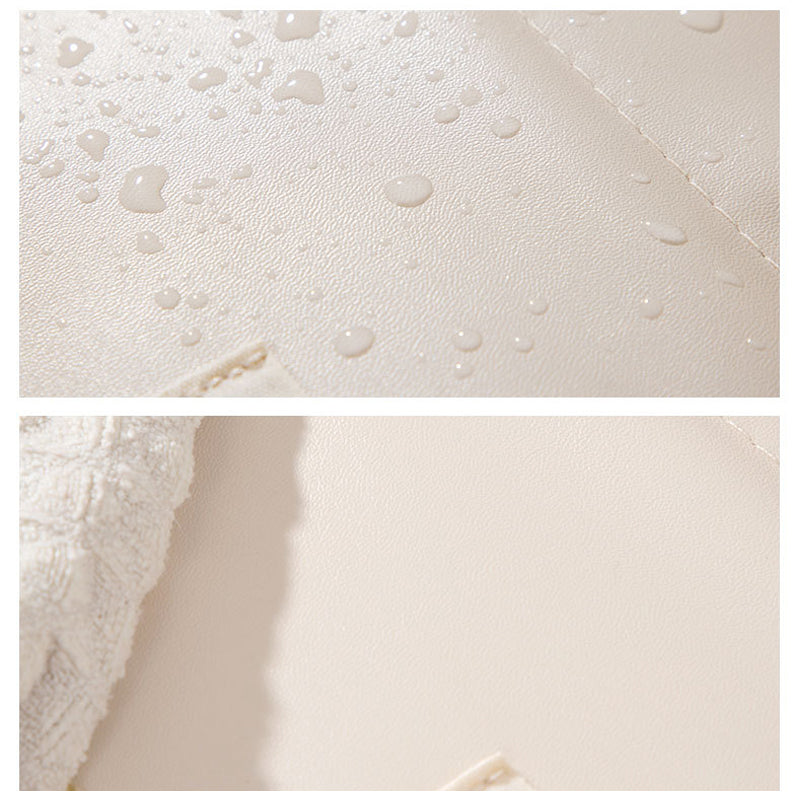 Spill-resistant wipe-clean cosmetic bag with soft-touch finish
