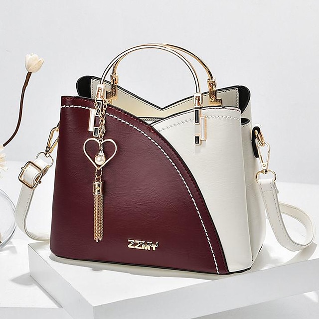 Women's Navy Blue and Pink Handbag with Heart Tassel Charm – Elegant Faux Leather Crossbody and Tote Bag for Everyday Use