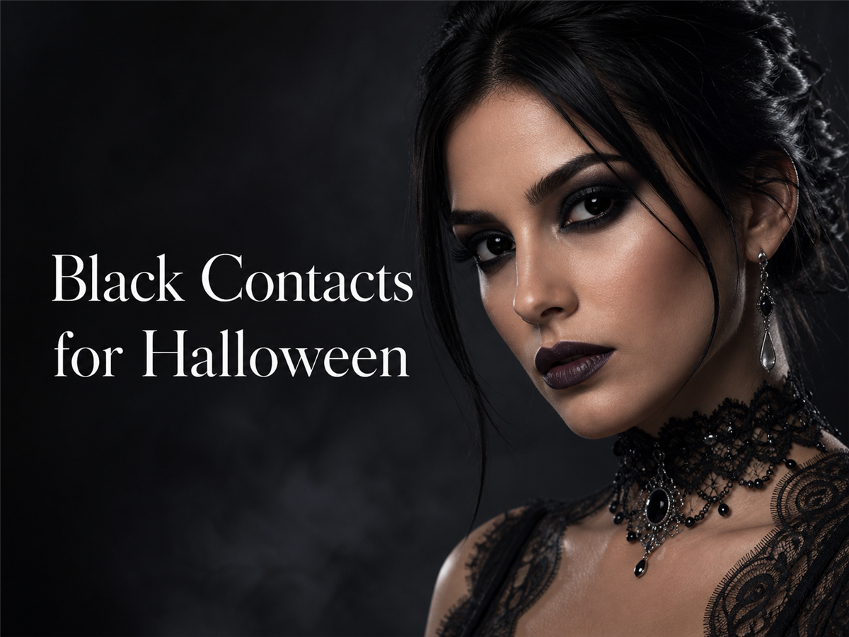 Gothic Halloween makeup look with opaque black contact lenses against a dark studio backdrop
