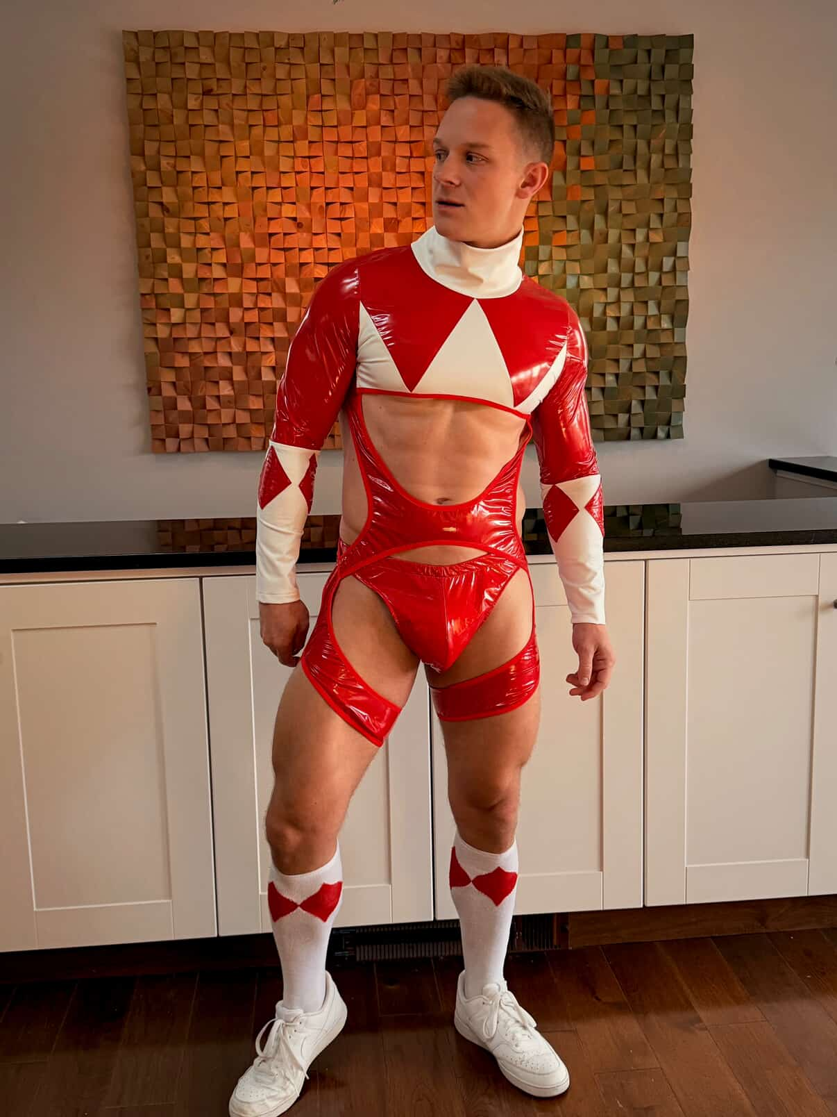 Joylgbt‘s  Men’s PU Leather Cutout Bodysuit – Red & White Geometric Long Sleeve Open Chest Design