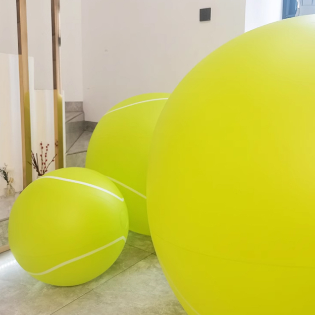 Giant bouncy tennis ball, tennis racket
