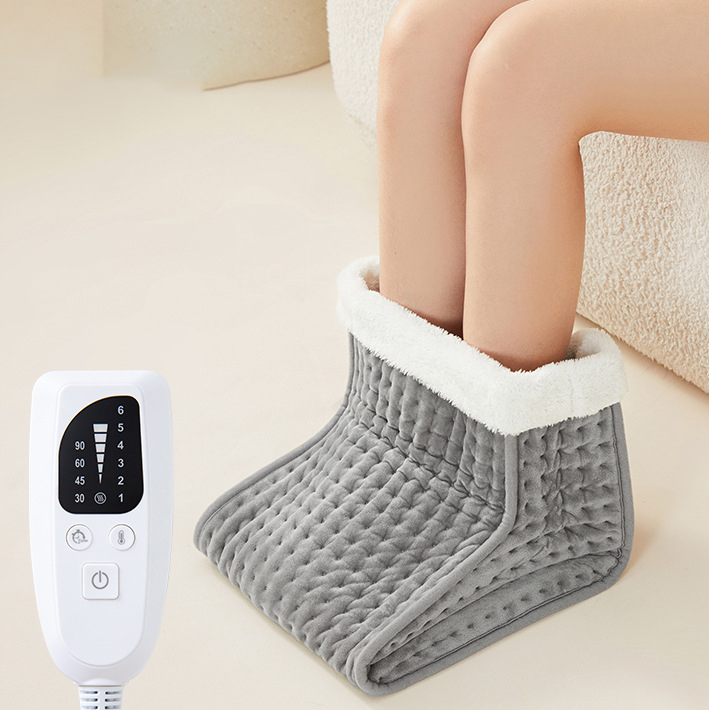 Heated pad for winter foot warmer