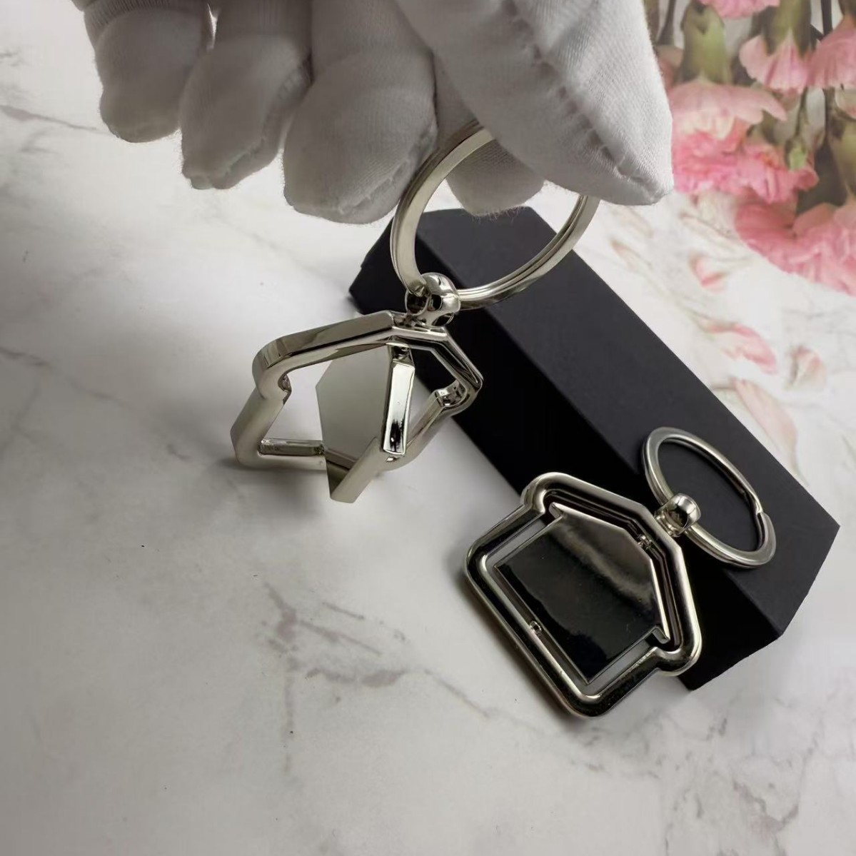 Rotating House Metal Keychain