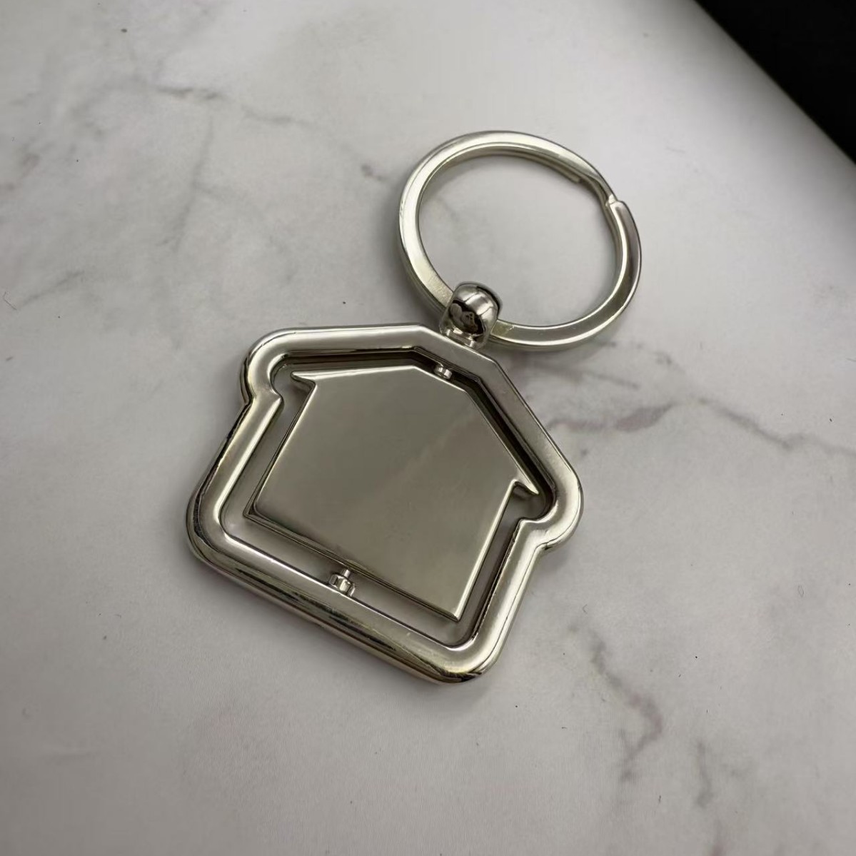 Rotating House Metal Keychain